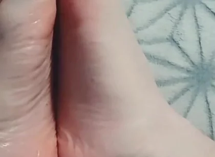 Guy Gently Massages His Feet with Oil