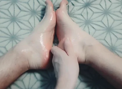 Guy Gently Massages His Feet with Oil