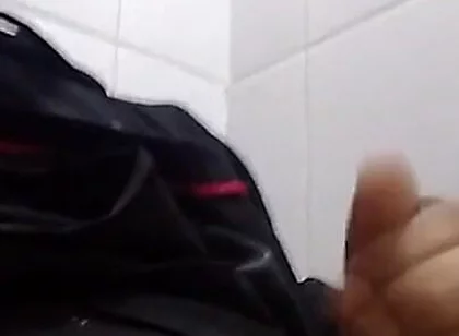 Man Sits in the Bathroom