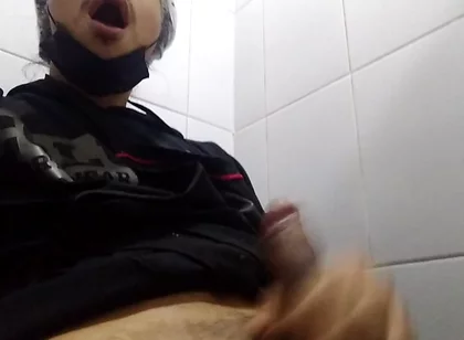 Man Sits in the Bathroom
