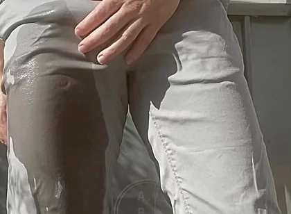 Jules Wets His Grey Pants and Exposes His Semi-hard Cock Through His Trousers