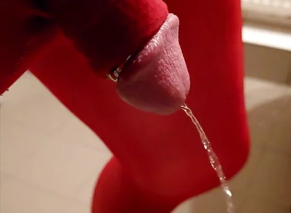 Pissing at Home in Red Legging with Penis Sleeve