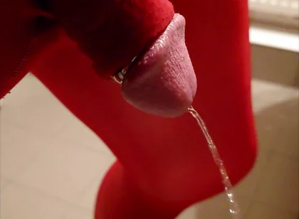 Pissing at Home in Red Legging with Penis Sleeve