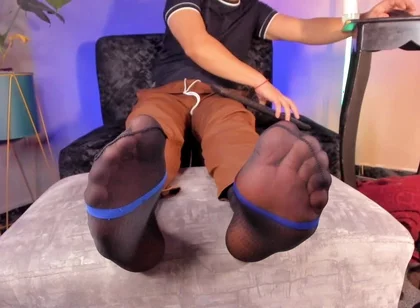 College Teacher Relaxes on the Couch at Home with His Feet on the Furniture so He Can Adore Them