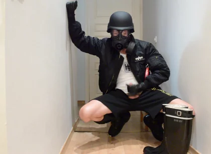 Gas masked guy cums on his rubber boots