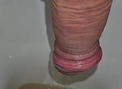 Male Peeing Into the Toilet