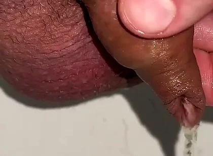 Playing with Foreskin While Peeing