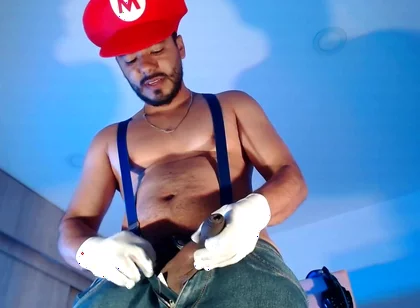 Dressed as Mario Bros Playing with His Plumbing Tool