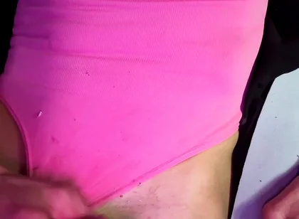 Crossdresser Michelle Wearing Pink Bodysuit While Playing with Cock