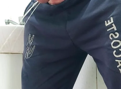 A Well-endowed Brazilian Man Urinating and Showing His Thick Penis to His Female Friends.