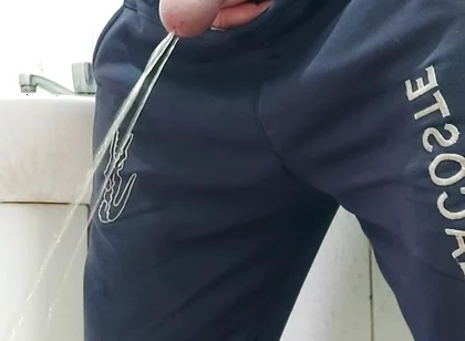 A Well-endowed Brazilian Man Urinating and Showing His Thick Penis to His Female Friends.