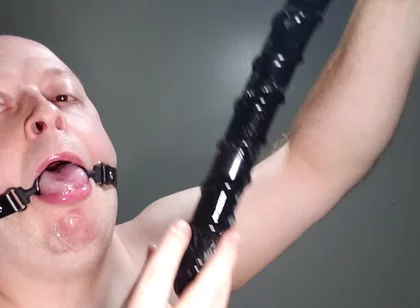 Deepthroating an 18 Inch Dildo with Mouth Gag Ring