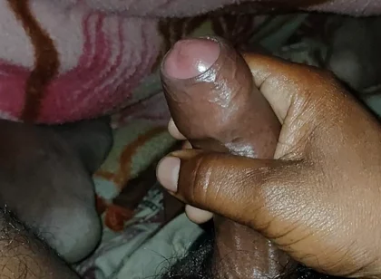 Big Boss massaging penis oil under the blanket