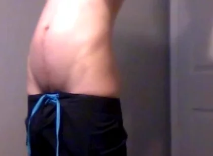Young Guy Fills His Stomach with Water