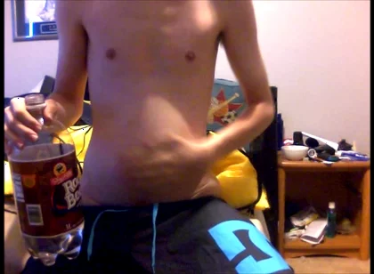 Young Guy Fills His Stomach with Water