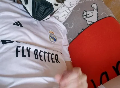 The Guy Is Wearing a Soccer Uniform and Mxhelmet with a Morning Cum