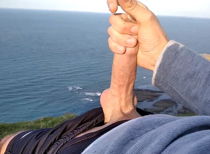 Huge Dirty Cock Gets Handjob on the Beach and Squirts a Lot of Thick Sperm in Front of the Beach
