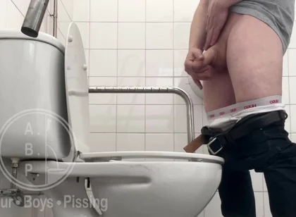 In the Hospital Toilets, a Guy Pisses Into a Cup for a Urine Sample, Then Gets Horny, Jerks-off and Cums