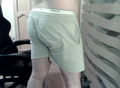 Muscular Camboy Flexes His Muscles and Squats