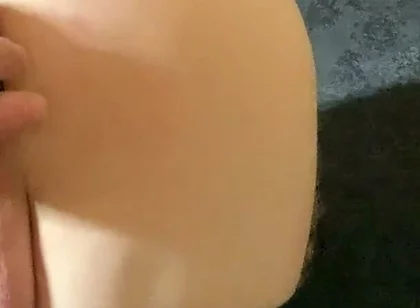 A Crossdresser in Leggings and a Seductive Bodysuit Plays with Ass