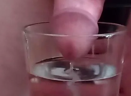 Cumming in a glass of hot water