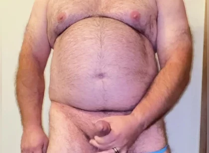 Anal Steve in His Blue Thong Showing off His Bear Body and Cock, with a Cock Ring on and Showing His Massive Butt Plug