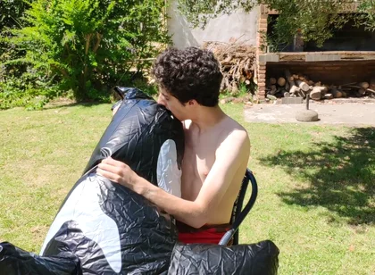Beautiful Man Inflates His Inflatable Whale Near Pool Outside