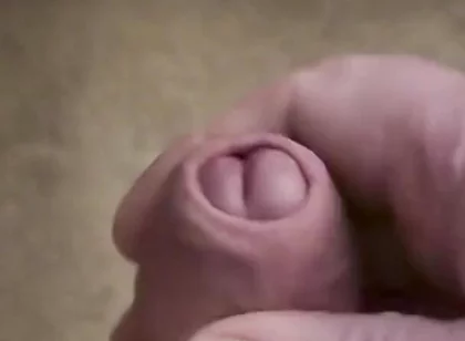 My Friend Sits in a Chair and Jerks off His Cock While Watching Video