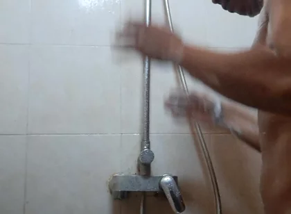 Exotic Skinned Asian Adult Man Taking a Shower in the Morning