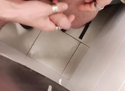 Jerking off a Cock in a Public Toilet